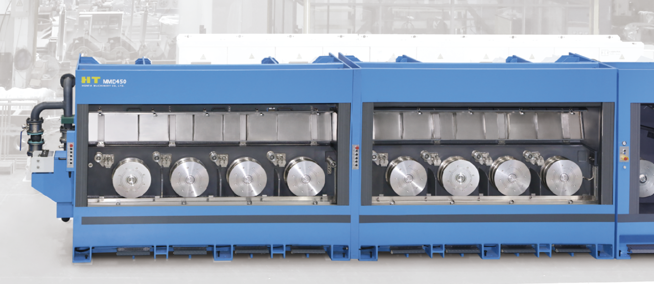 MMD450 rod breakdown machine with open covers showing the horizontal drawing capstans